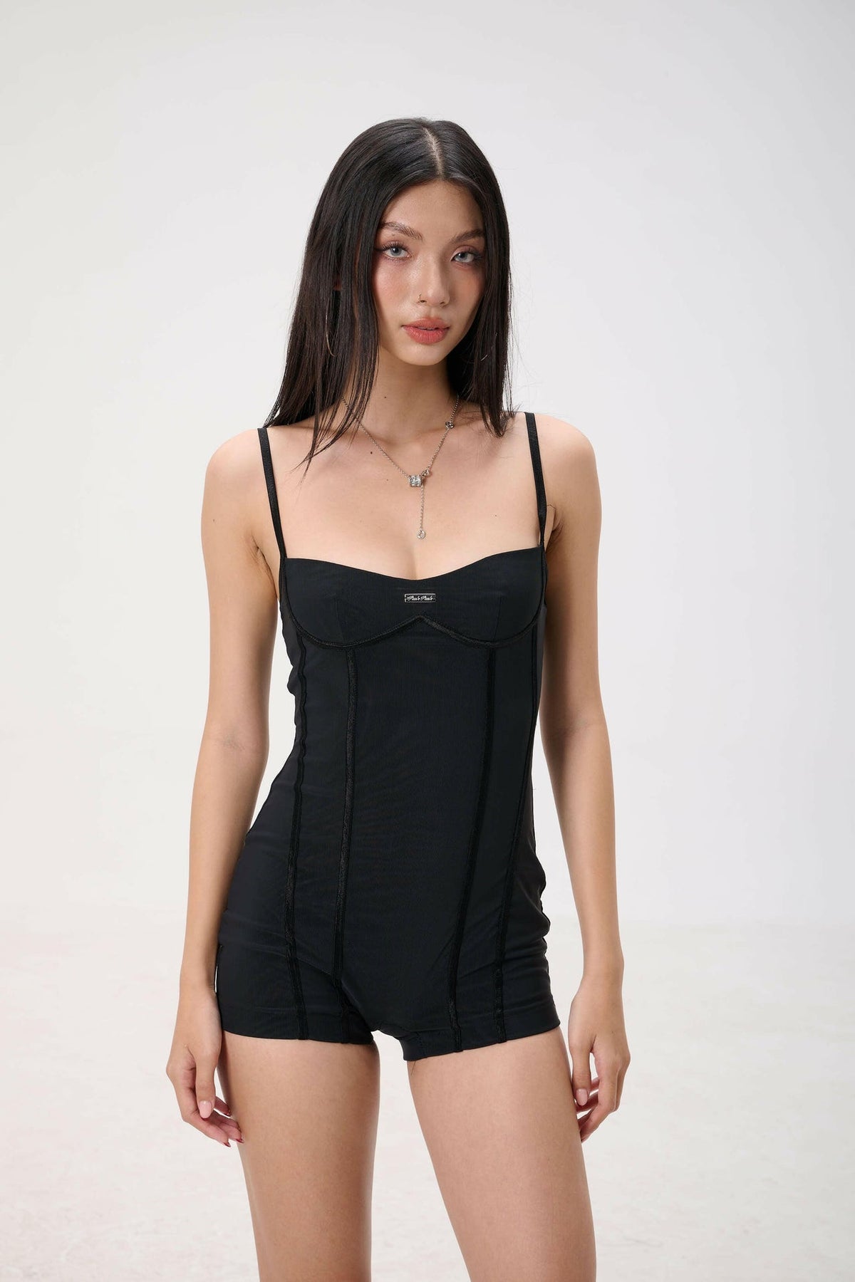 NAOMI PLAYSUIT.